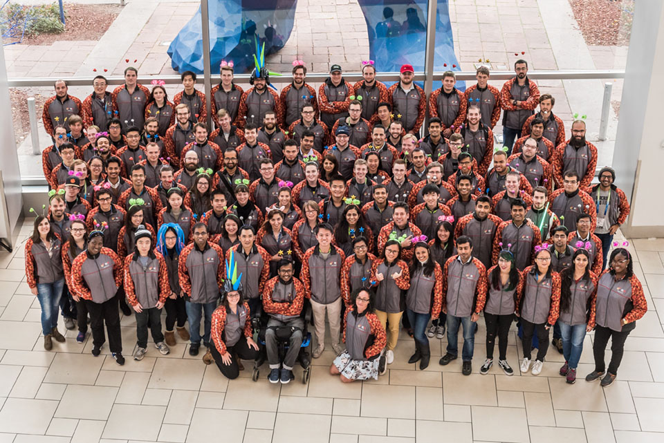 A group of young people pose for a picture.